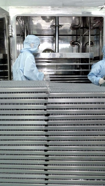 Stacked vial trays waiting to be loaded